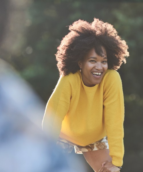 woman in park looking happy