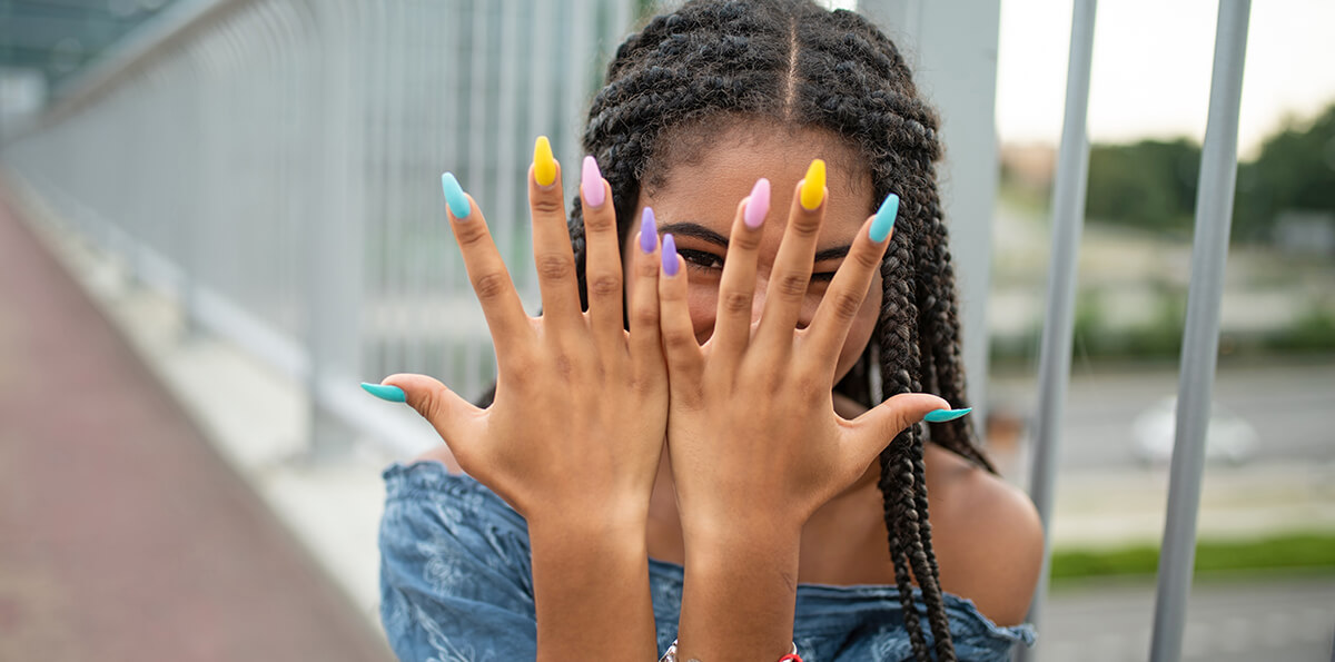 female with coloured finger nails