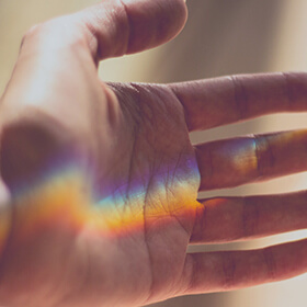 hand with glass light reflection