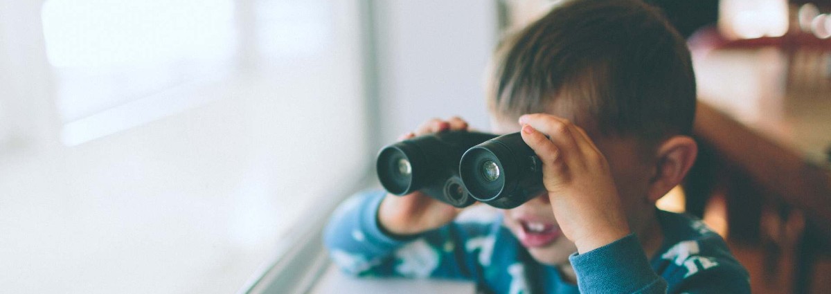 young boy with binoculars