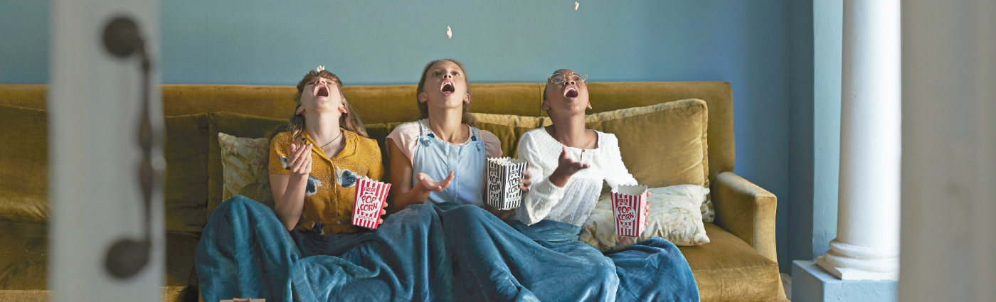 children on sofa having fun