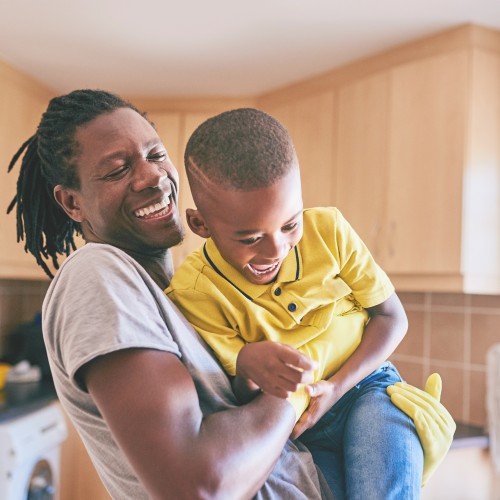 father holding child