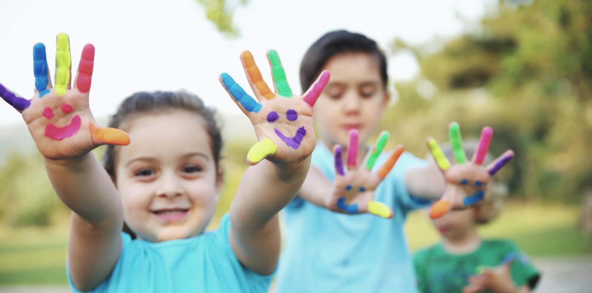 happy children with painted hands