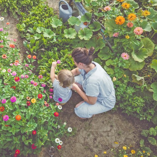 Mother with young child in garden