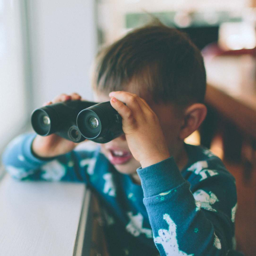young boy with binoculars 