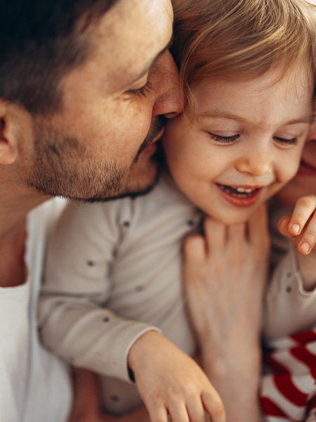 Parents holding a young child.jpg