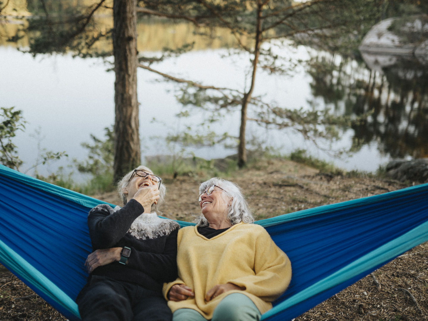Two women sitting in a hammock