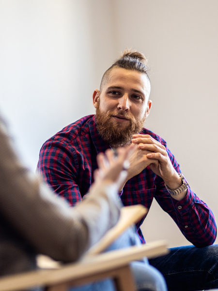 Employer - Two people in an office setting having a conversation.jpg