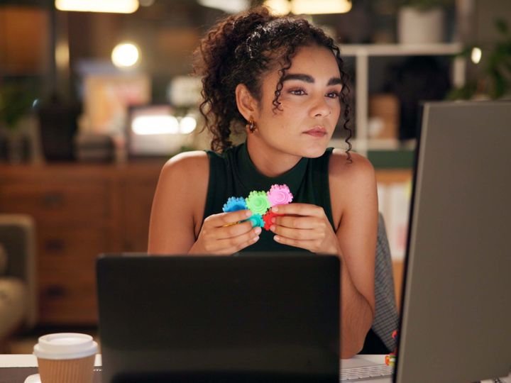 Woman working from home at a computer screen