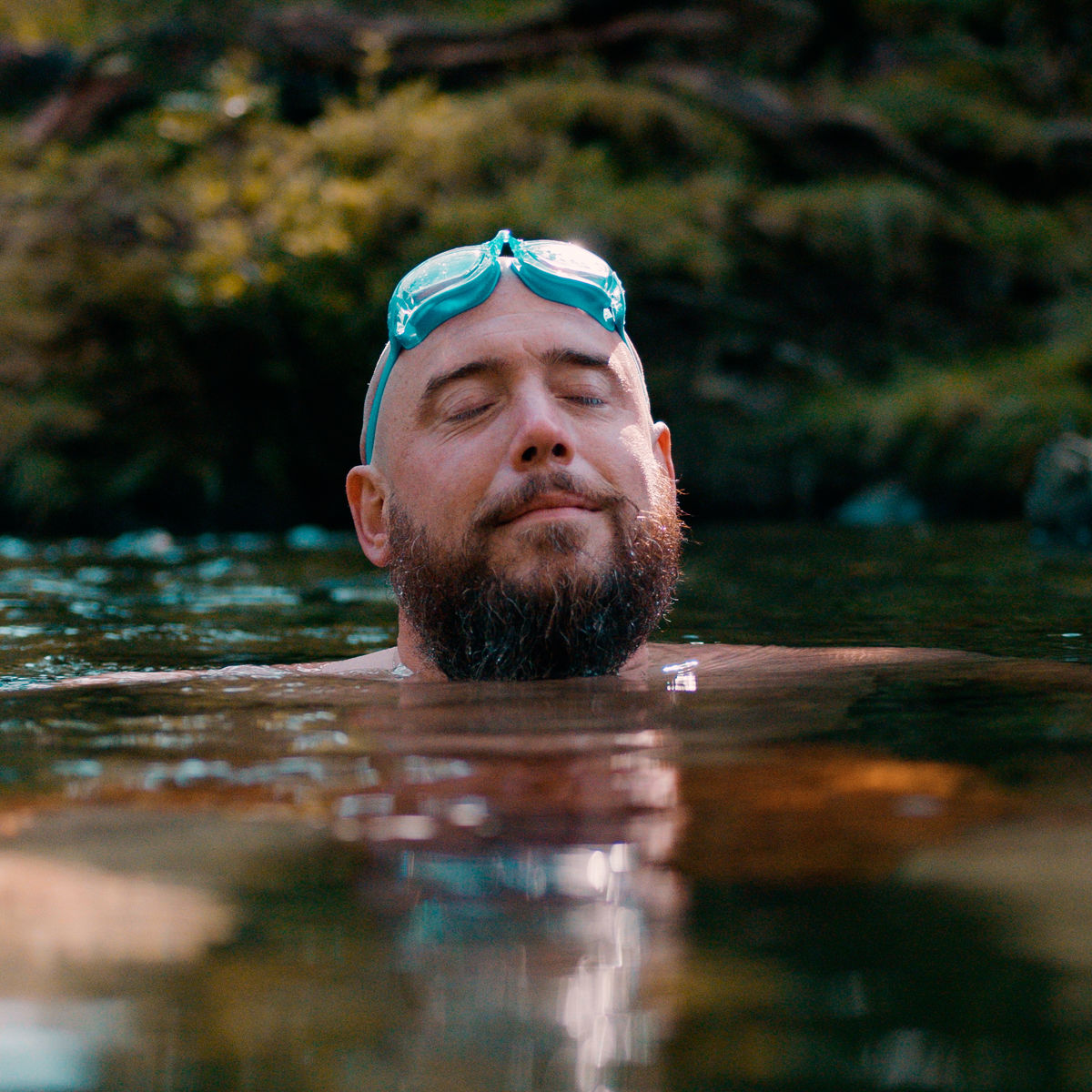 Man wild swimming in a river.jpg