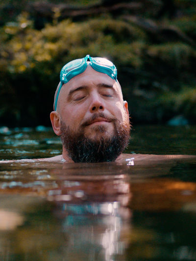 Man wild swimming in a river.jpg