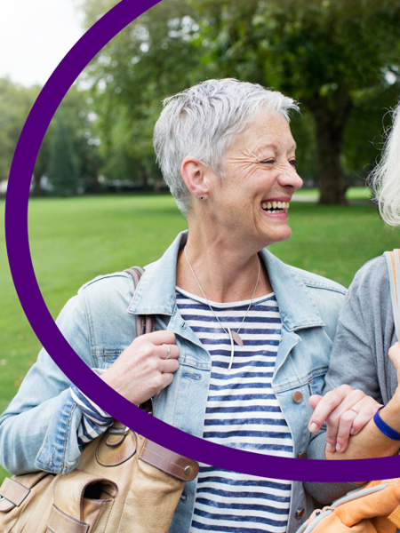 Two women walking in a park.jpg