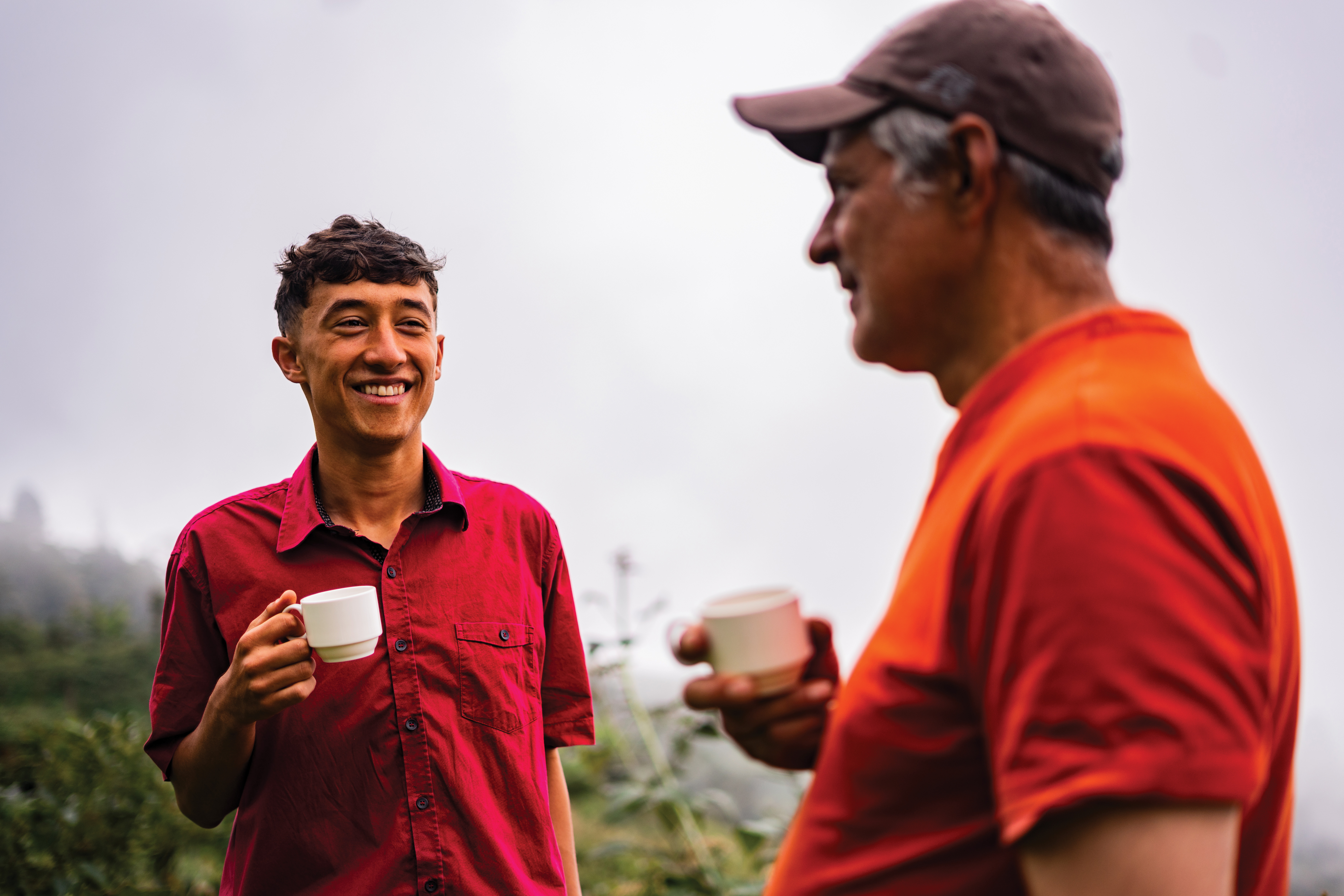Two people sharing a cup of tea outside.jpg