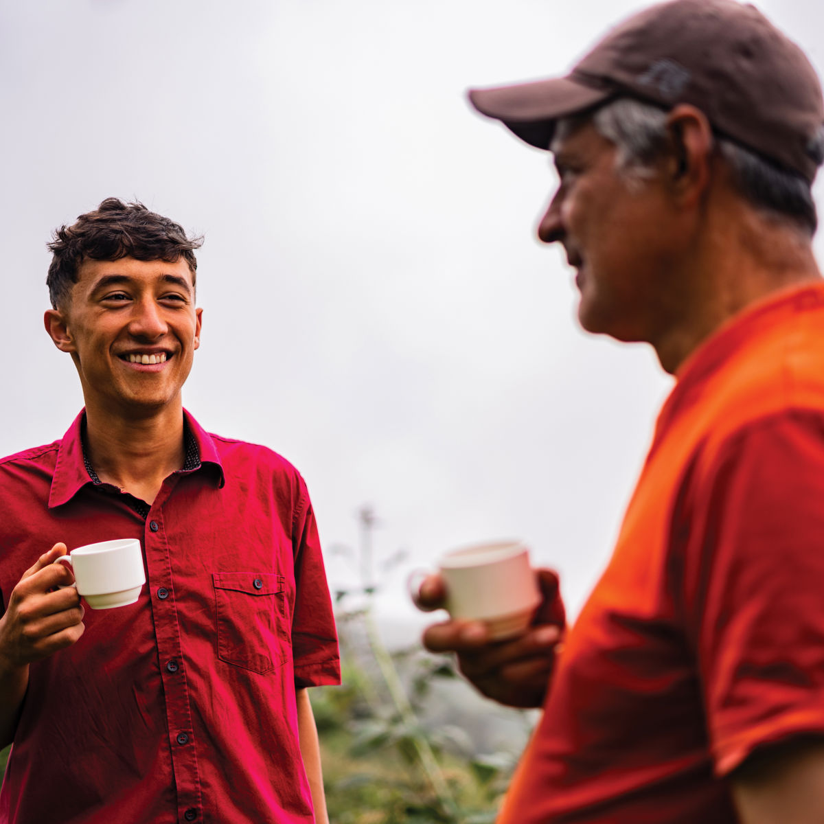Two people sharing a cup of tea outside.jpg
