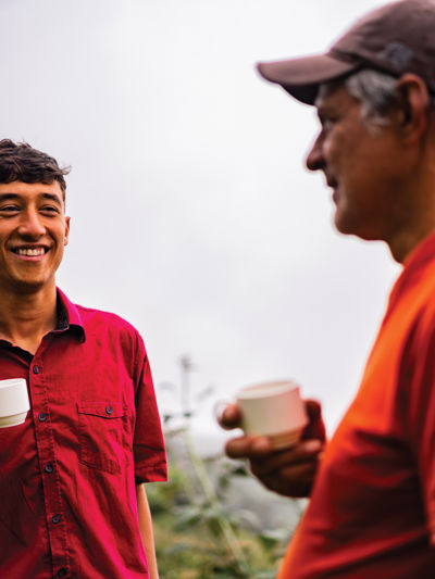 Two people sharing a cup of tea outside.jpg