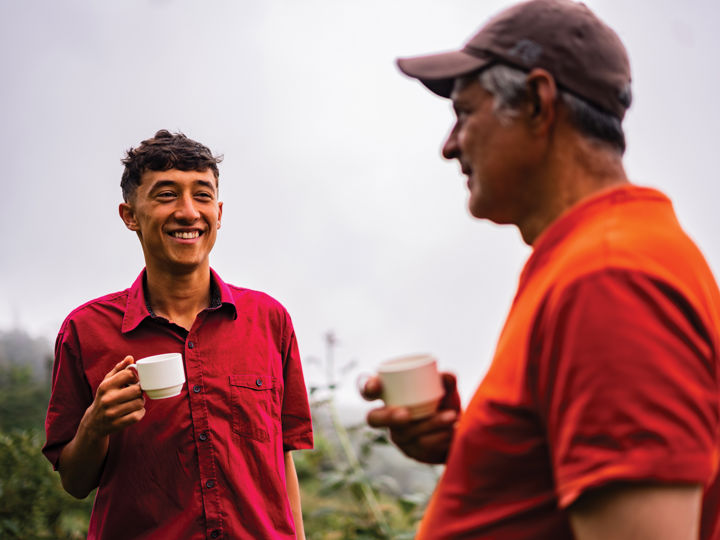 Two people sharing a cup of tea outside.jpg