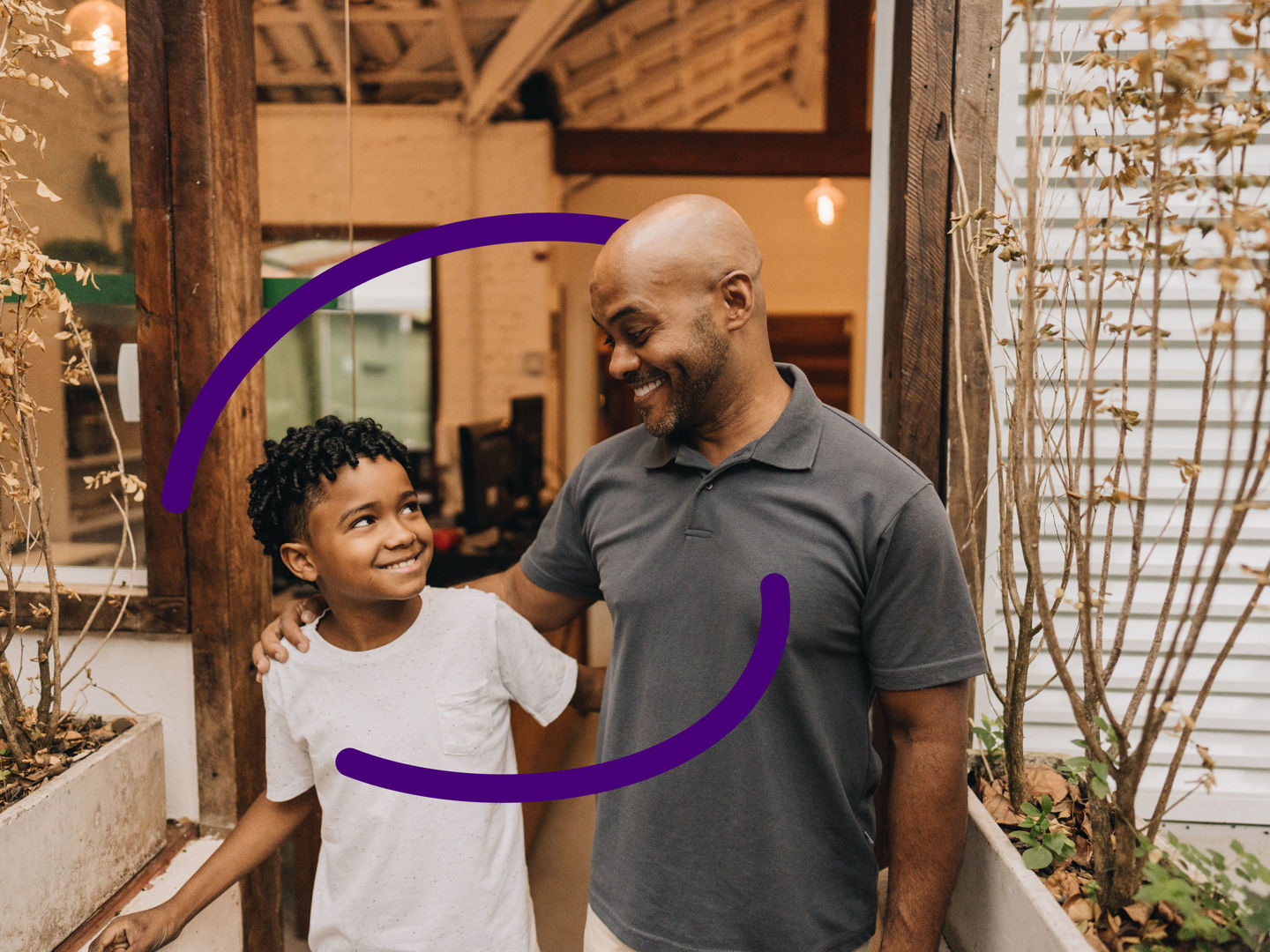 Parent and child standing outside a house - with Clinical Partners brand expression