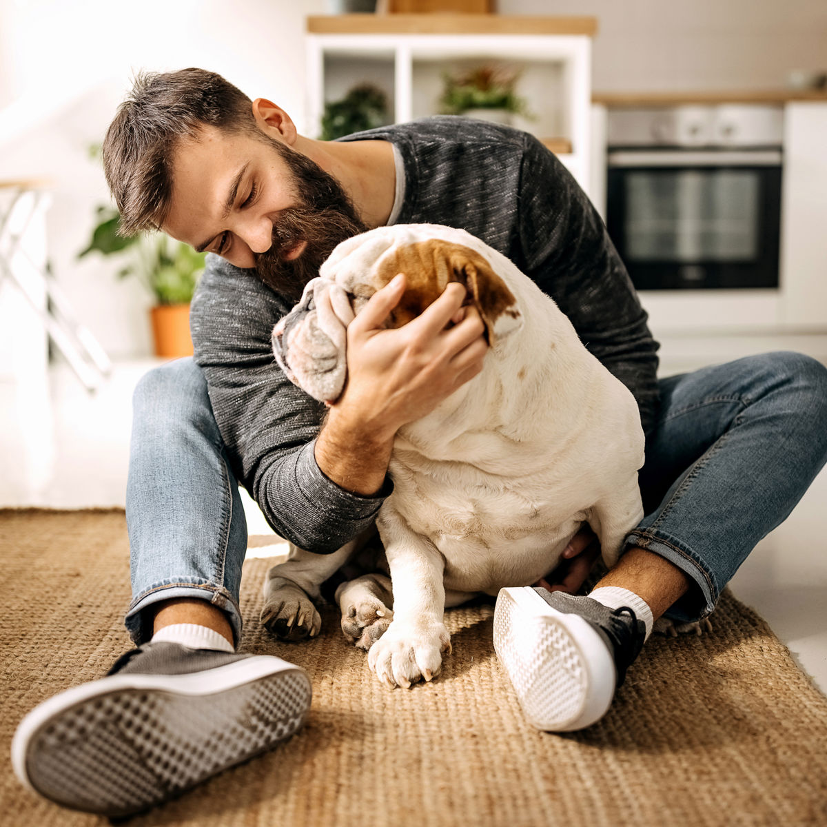 Man sitting on the floor with a dog.jpg