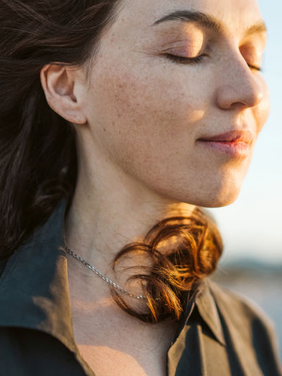 Women with calm expression and eyes closed.jpg