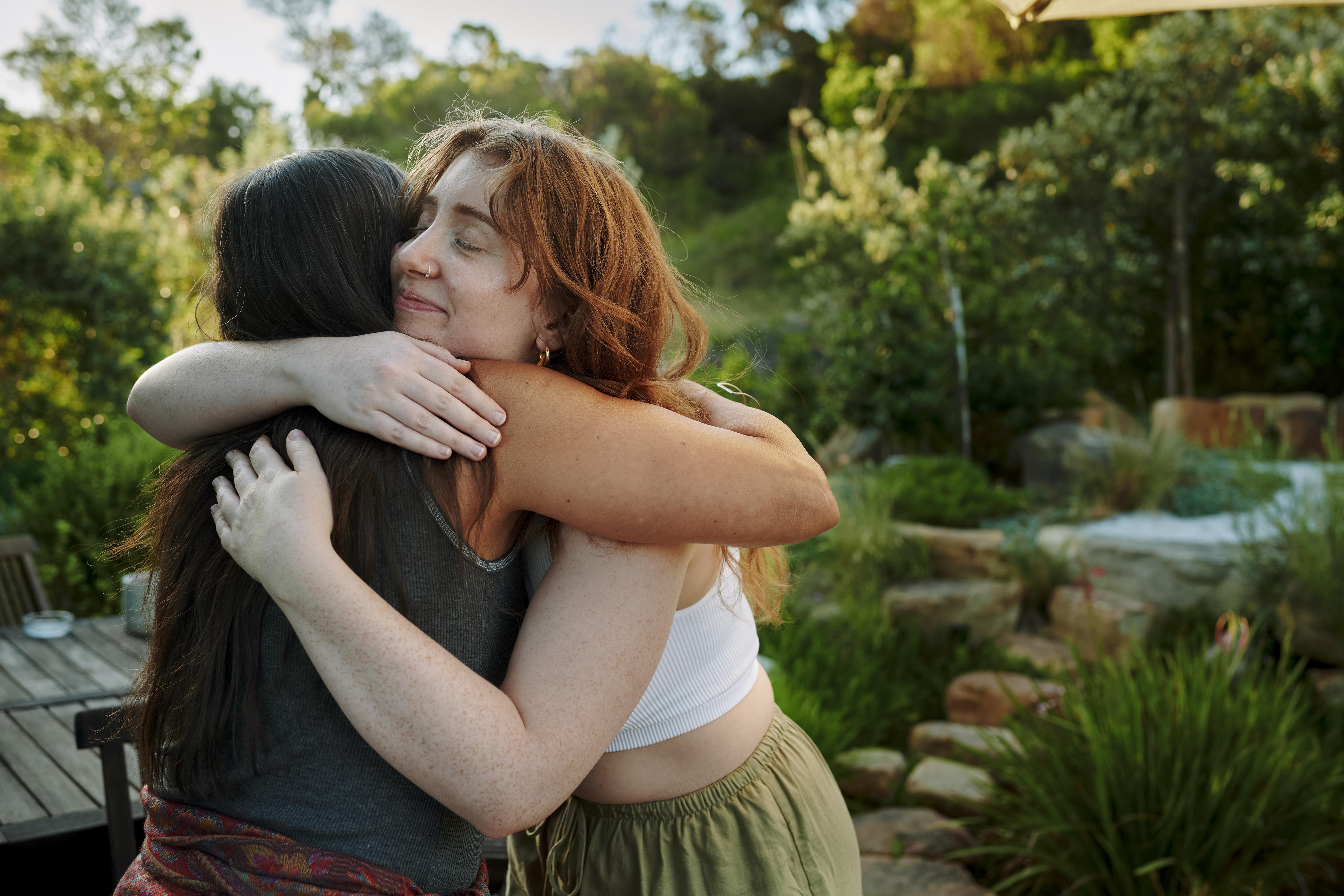 Two friends hugging outside.jpg