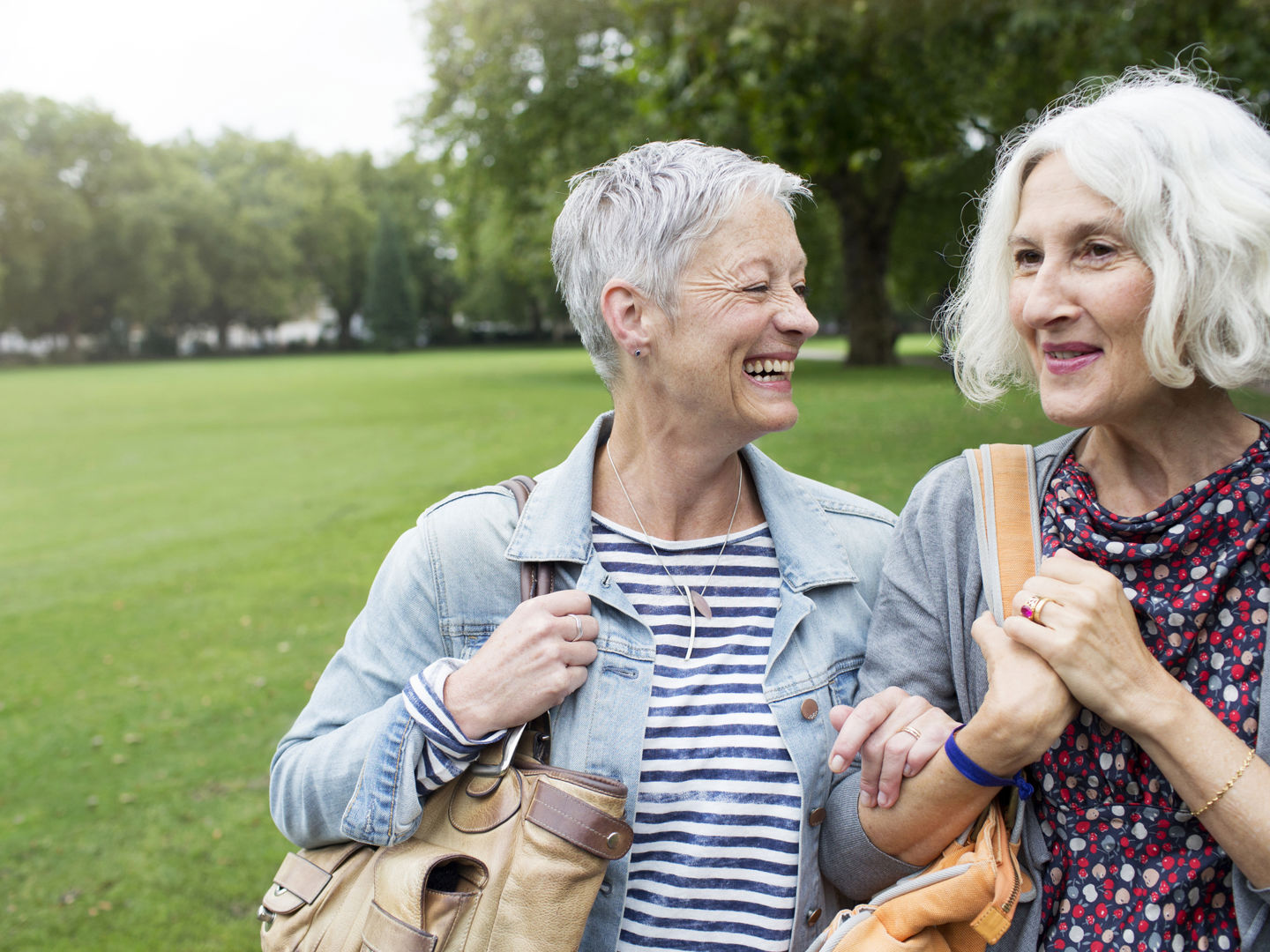 Two people walking together in a park