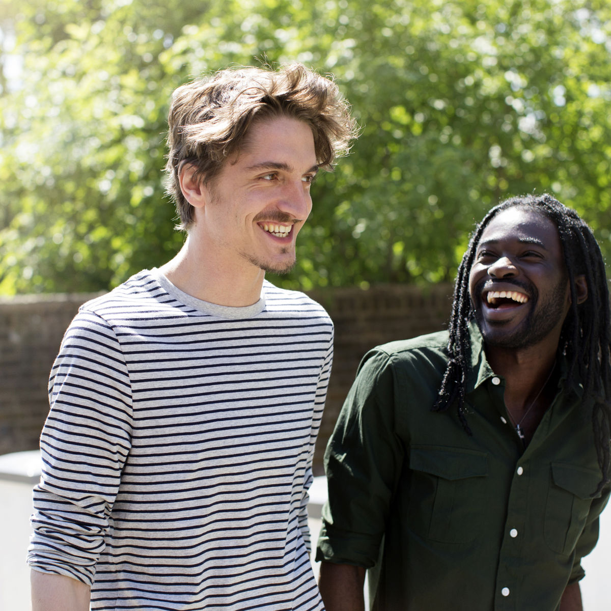 Two men outside walking together.jpg