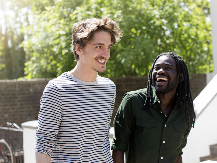 Two men outside walking together.jpg