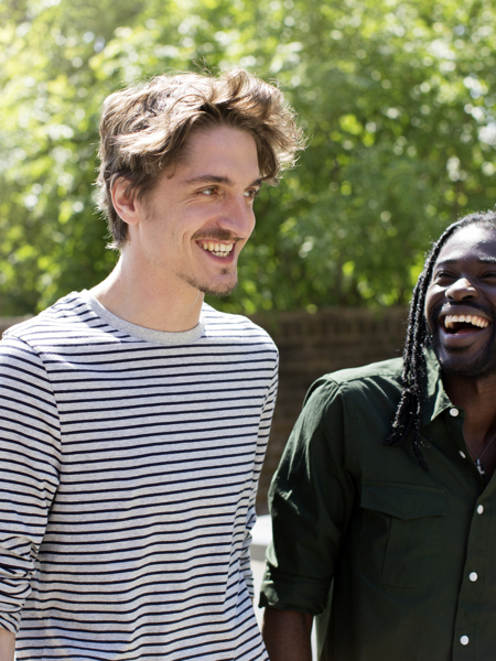 Two men outside walking together.jpg