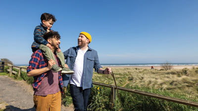 Family on a walk with child up on shoulders.jpg